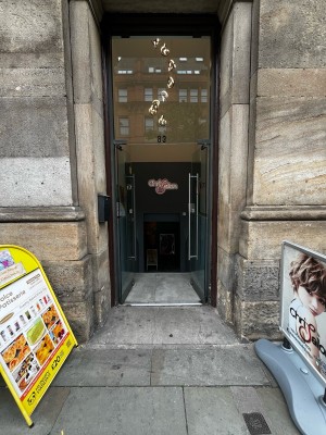 Preceding glass doors ahead. Push from metal handles in centre to open.