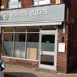 This is large single silver door to the restaurant.

Step free access and car parking outside for customers.
