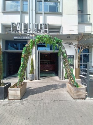 From street, facing venue. Archway ahead.
