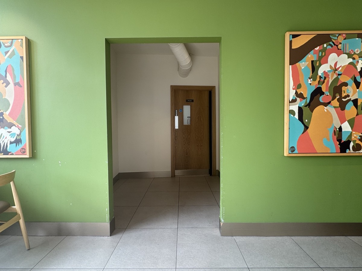The path to the toilets is well lit, but lacks wall signage, making it slightly difficult to locate them at first glance.