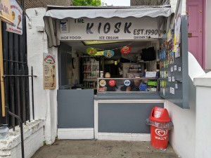 From pavement facing venue. Counter with till ahead.