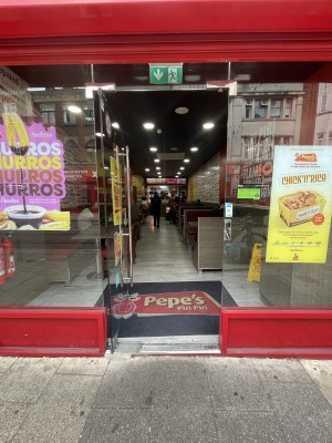 Glass door ahead. Push silver metal handle from right to open.