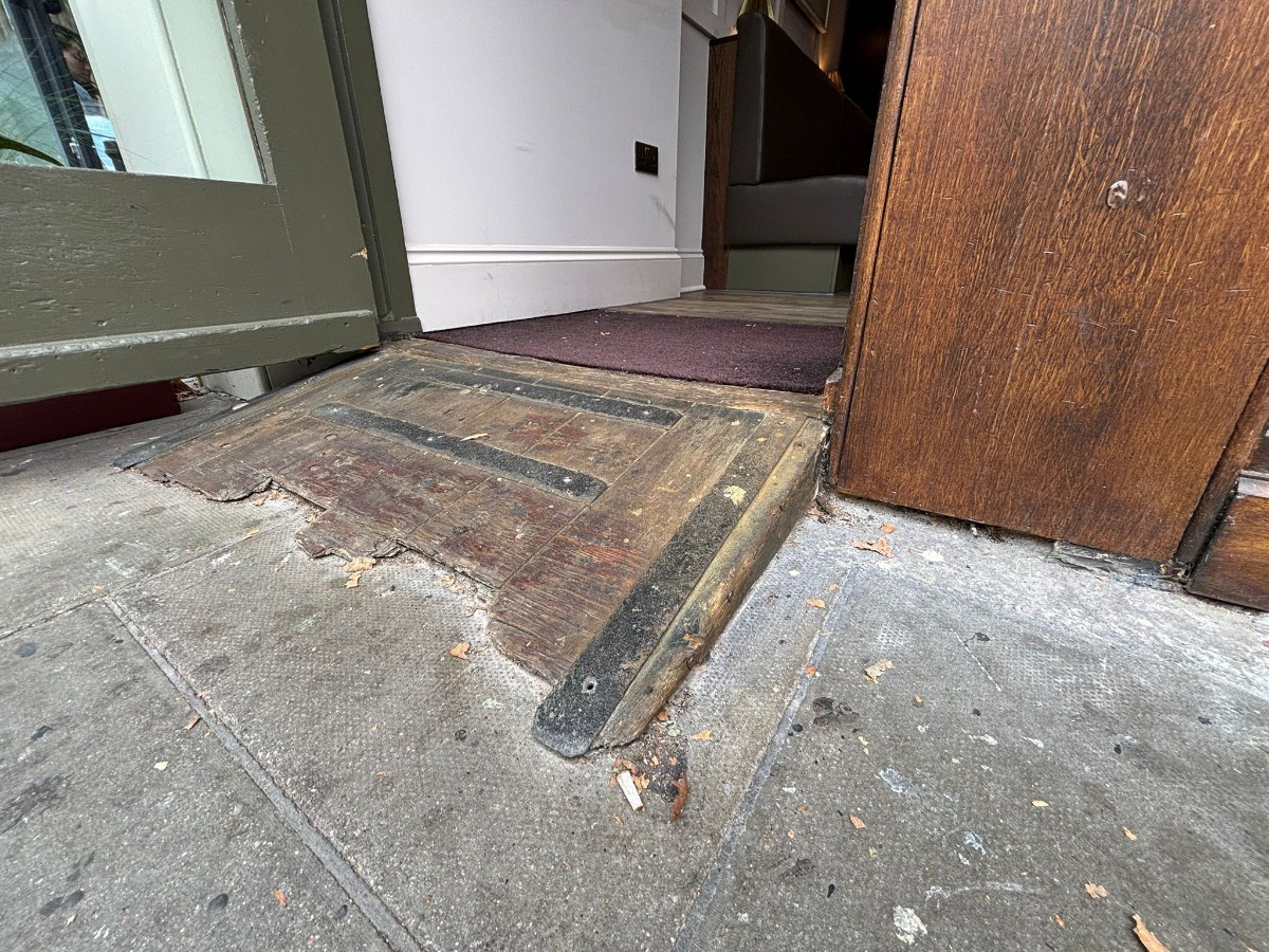 Ramp up before doorway. Uneven flooring at beginning of ramp.