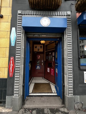 One step up to preceding blue doors ahead. Push from centre to open.