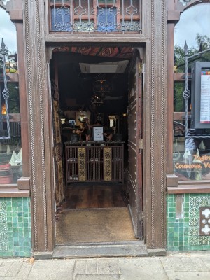 Wooden door with wooden frame. Push from left to open.