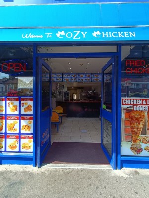 Glass doors with blue, metal frames. Push from middle to open.