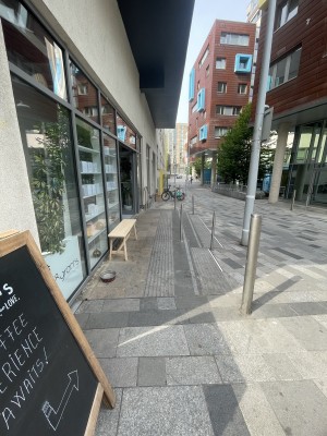From street facing side of venue. Path down centre to venue doors ahead to left.