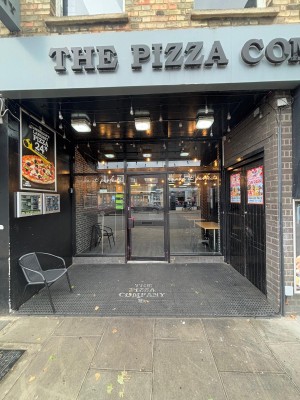 Opening ahead. Chair on left, door to venue at back.