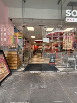 Glass doors. Metal handle on right. Right door sign please use left door.