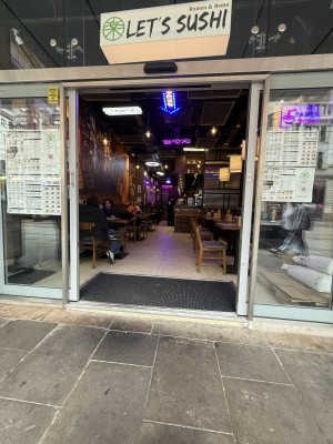 Silver framed glass doors. Silver handles in centre. Slide from centre to open.
