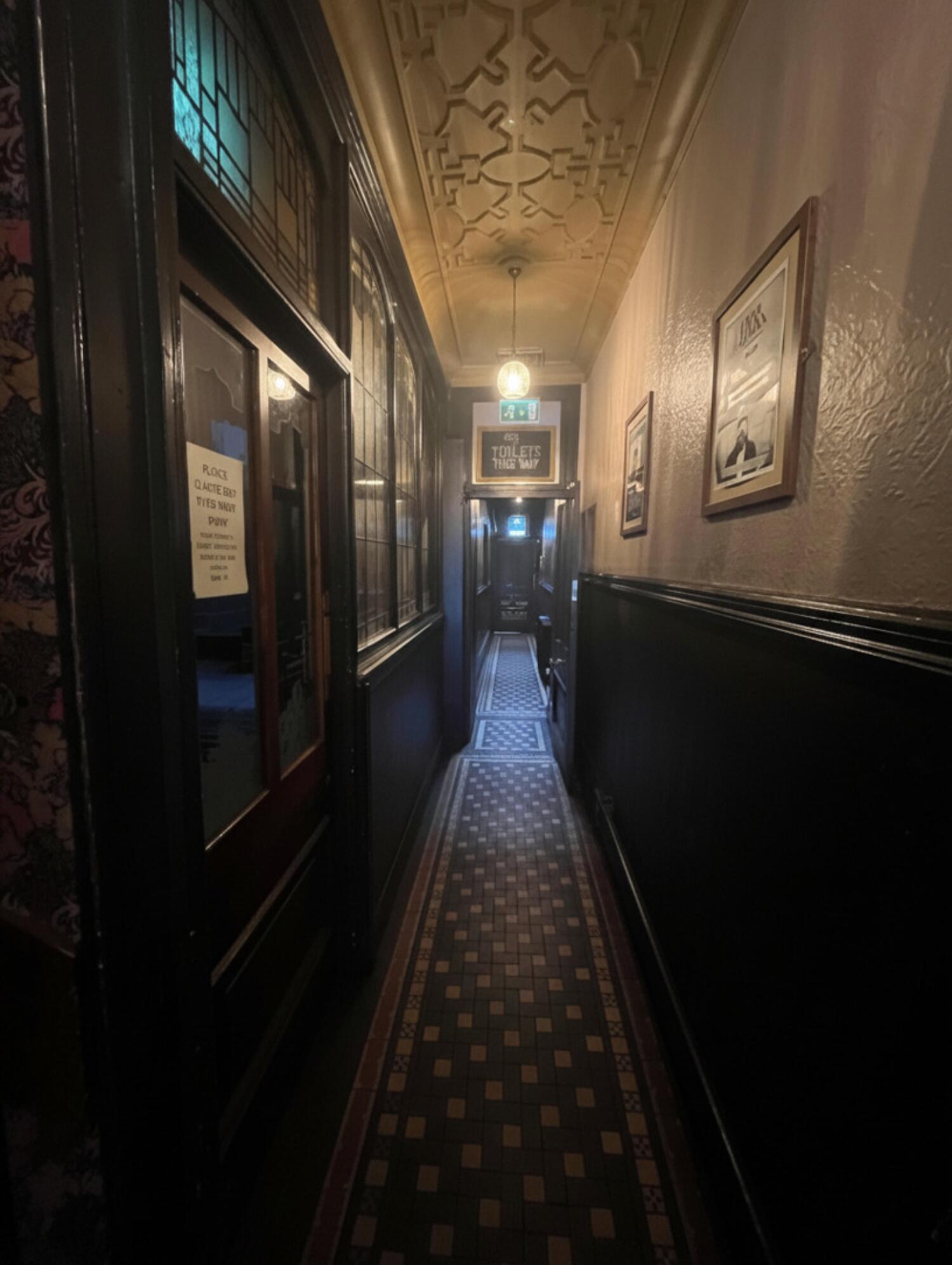 From staircase facing right. Path ahead to door on back.