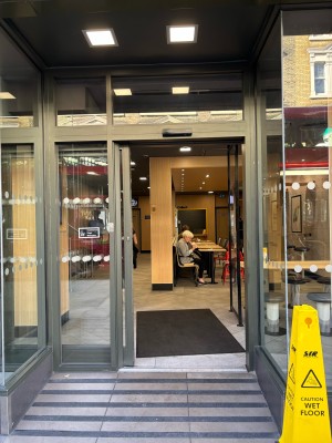 Opening ahead to glass doors on back. Doors automatically slide to left to open.