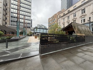 From street facing venue. Opening ahead. Step up at foot of opening. Venue on right after opening.