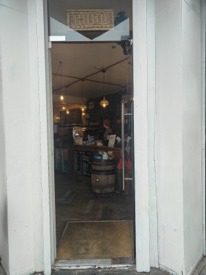 Glass door. Push handle on left to open.