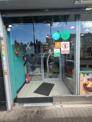 Glass door. Push metal handle on right to open.