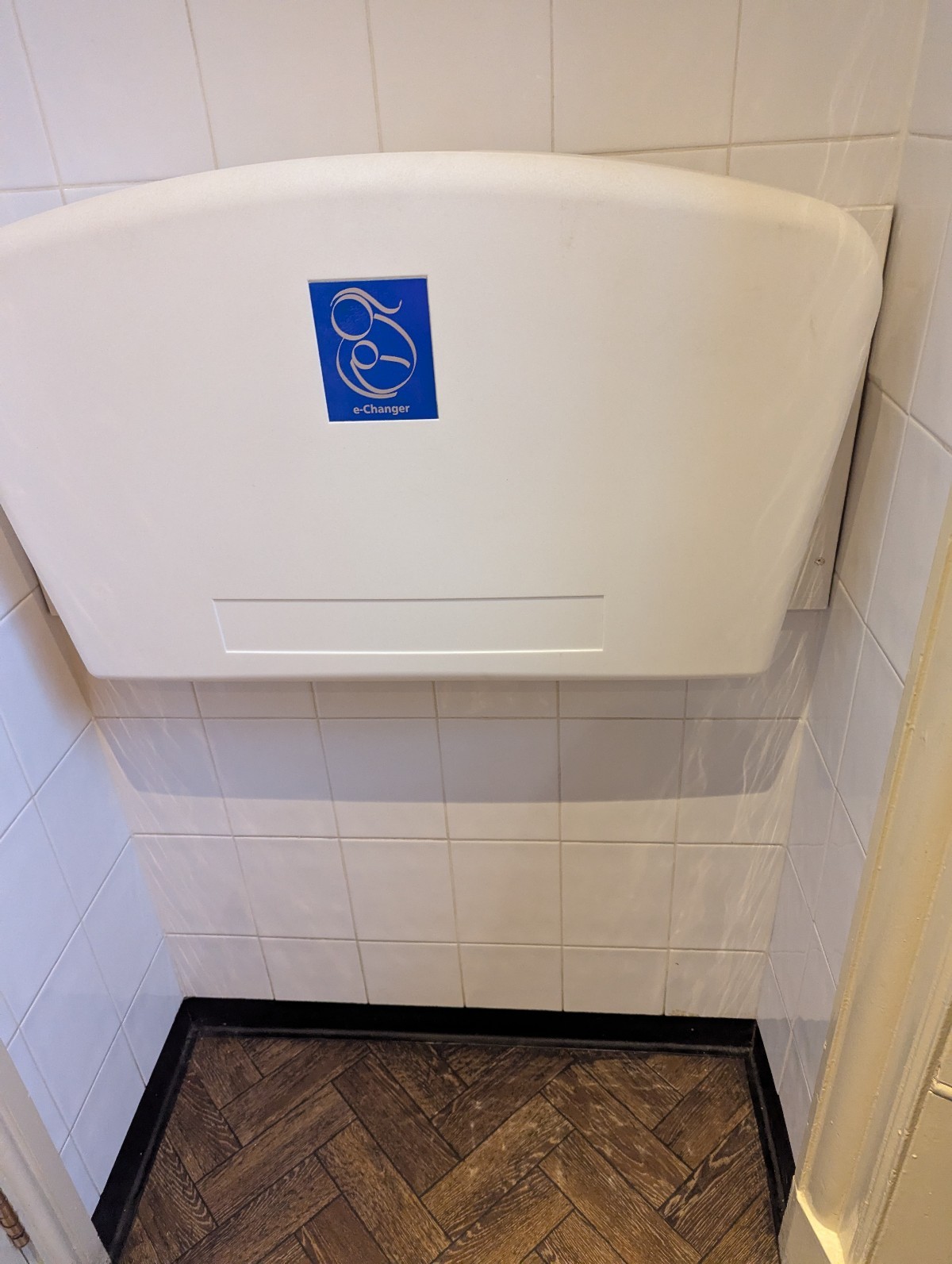 Baby change facilities inside the second toilet in the ladies bathroom