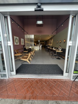 Glass double door with a white frame. Automatic door.