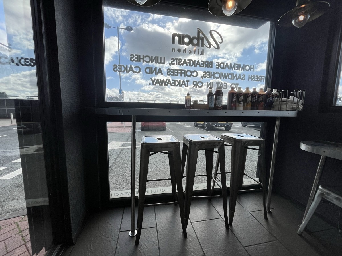 From entrance facing left. Tables and stools ahead.