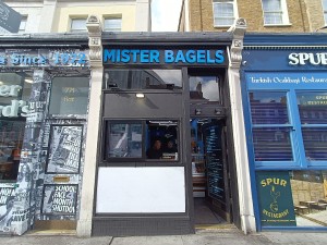 From street, facing venue. Counter at back. Staff doorway at back right.