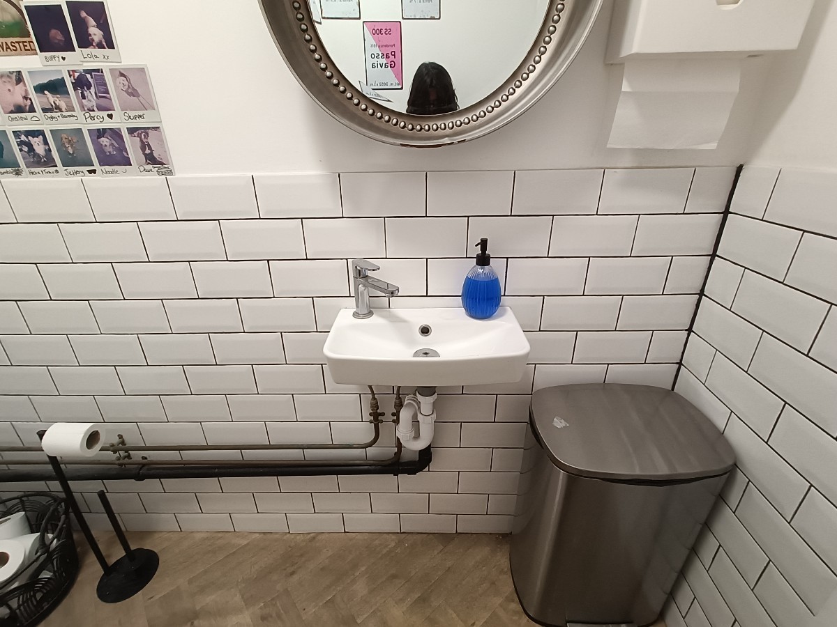 From doorway, facing right. Sink at back.