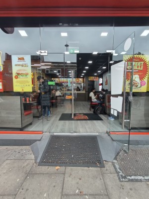 Glass doors. Push or pull silver handles in centre to open.