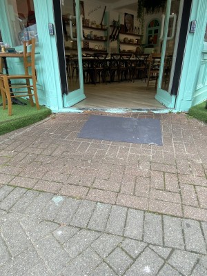 Built-in ramp with doormat leading to the entrance door.