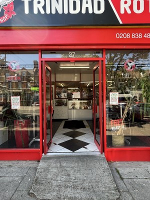 Double glass doors with red door frame. Glass walls on either side.