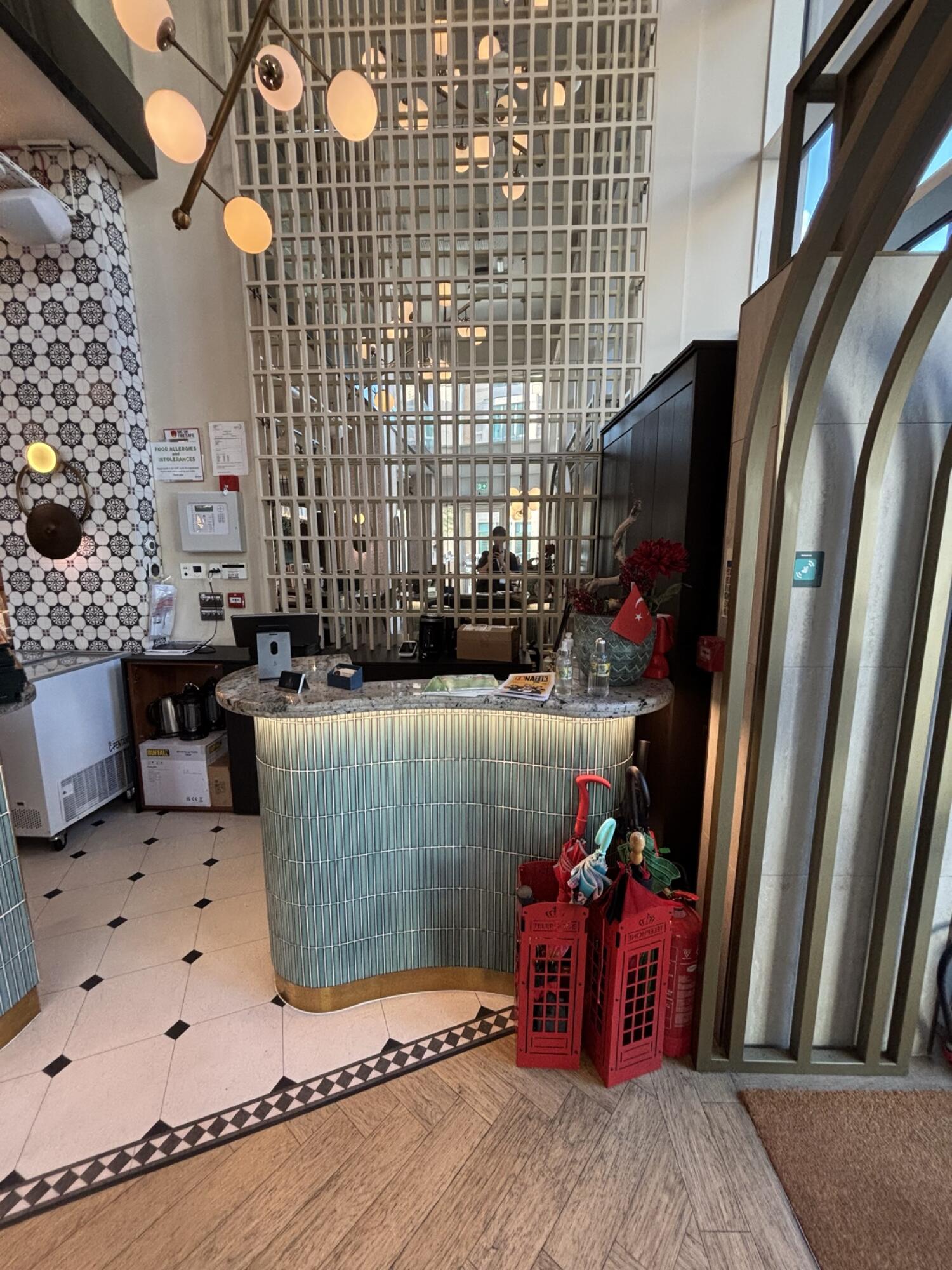 From doors facing straight. Welcome desk ahead.