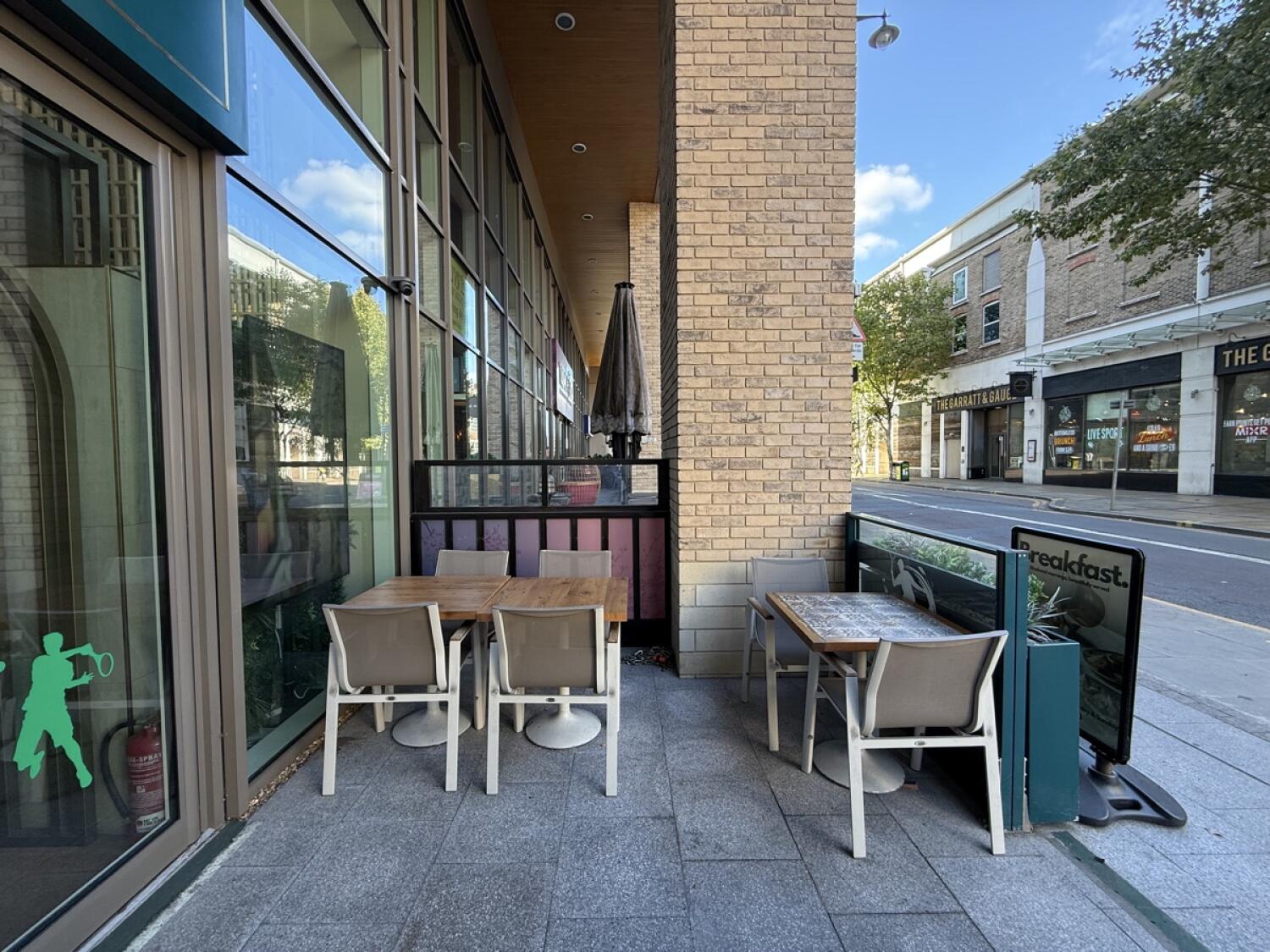 From entrance facing right. Tables and chairs ahead.