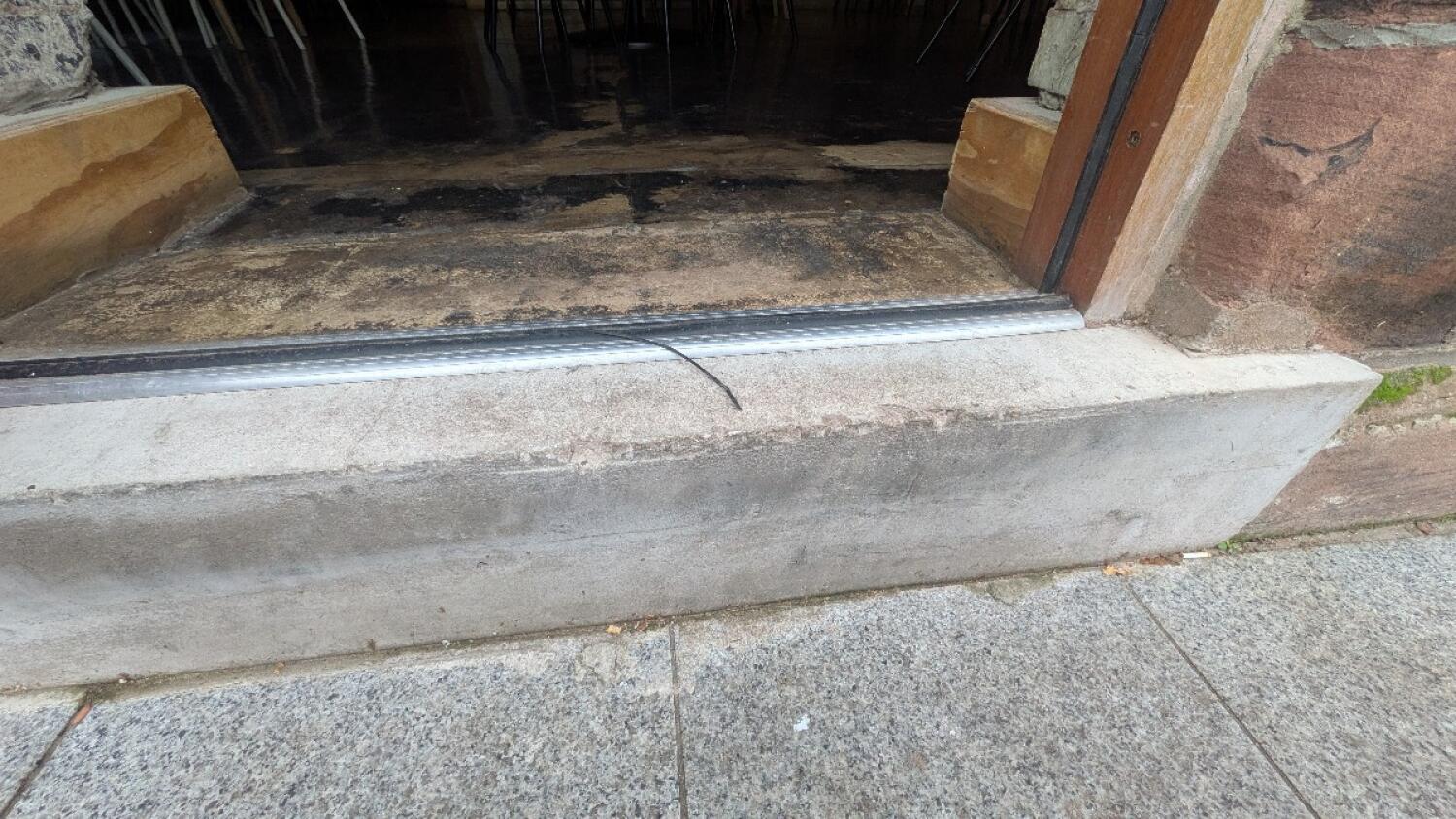 Step and bump at foot of door.