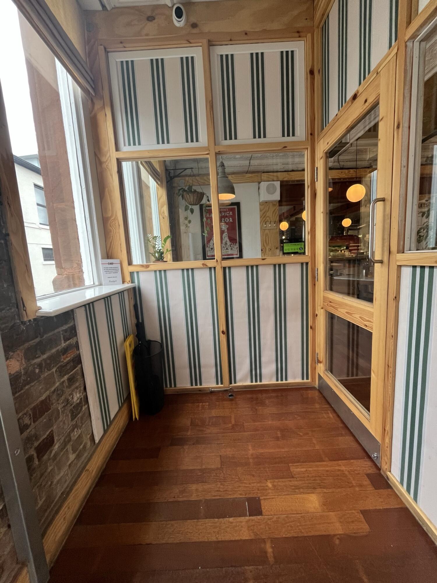 From end of stairs facing straight. Wall at back. Door on right.