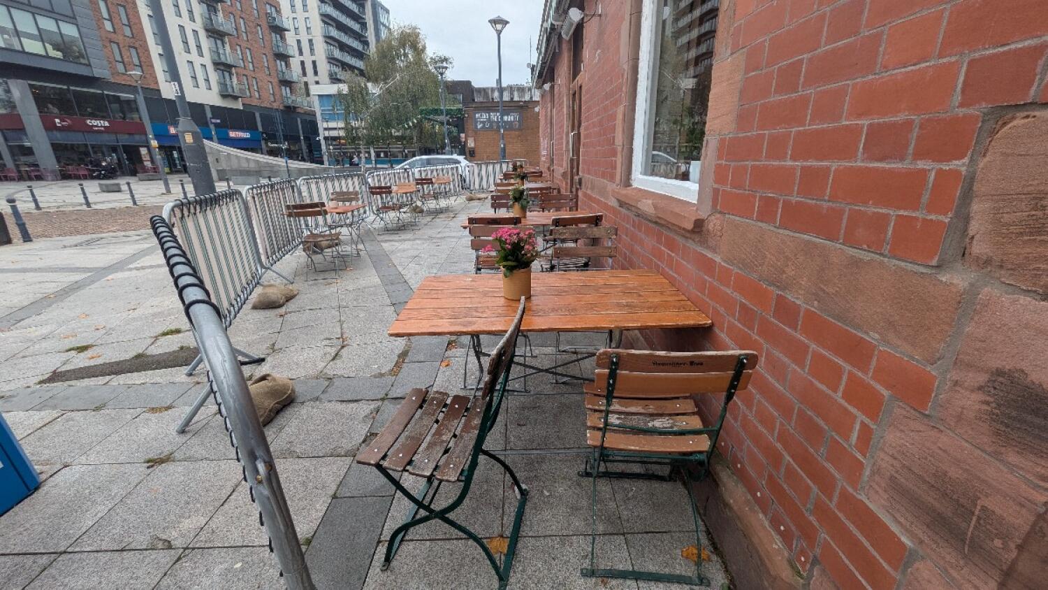 From alternate entrance facing left. Tables and chairs along center and back left