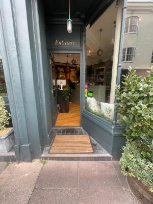 One step up to entrance door at back.