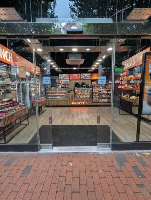 Double glass door with no handles.