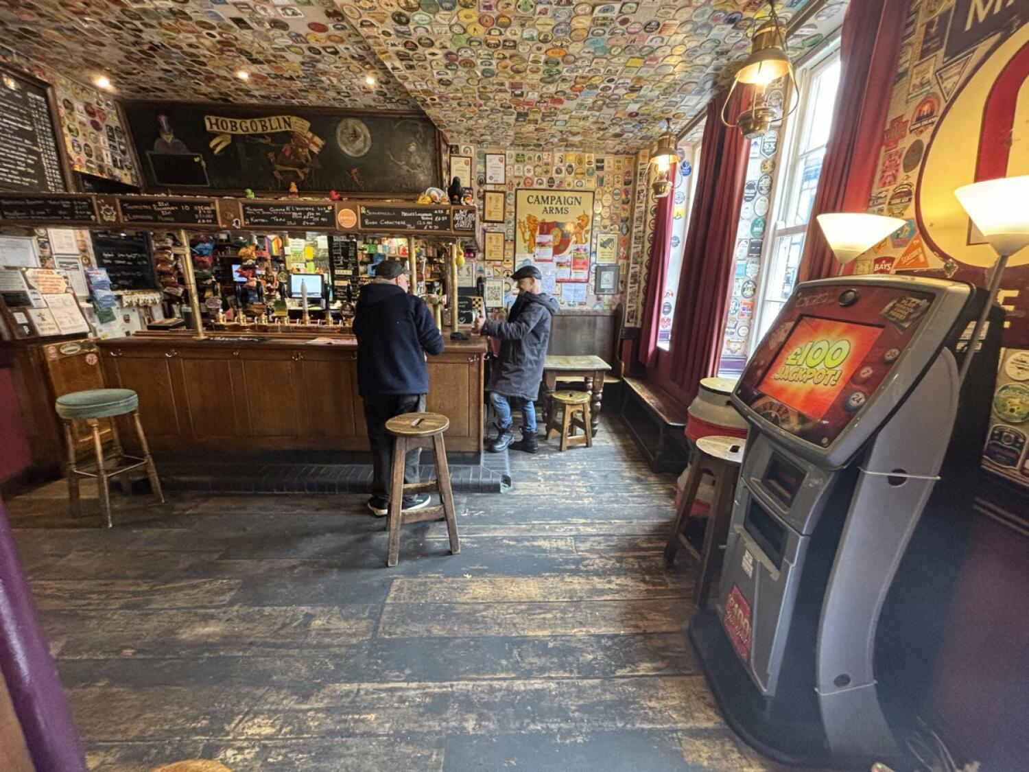 From entrance facing right. Bar counter and stools at back ahead.