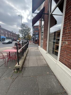From street facing venue. Built in ramp ahead. Rails along the left.