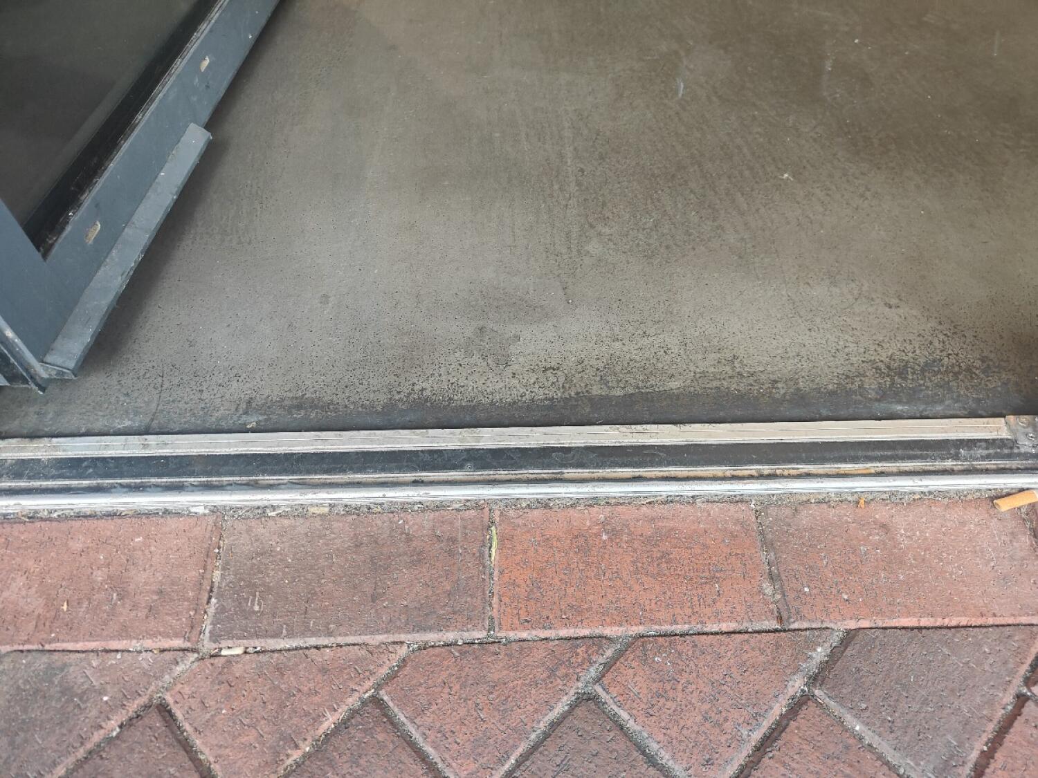 Small metal bump at door threshold.
