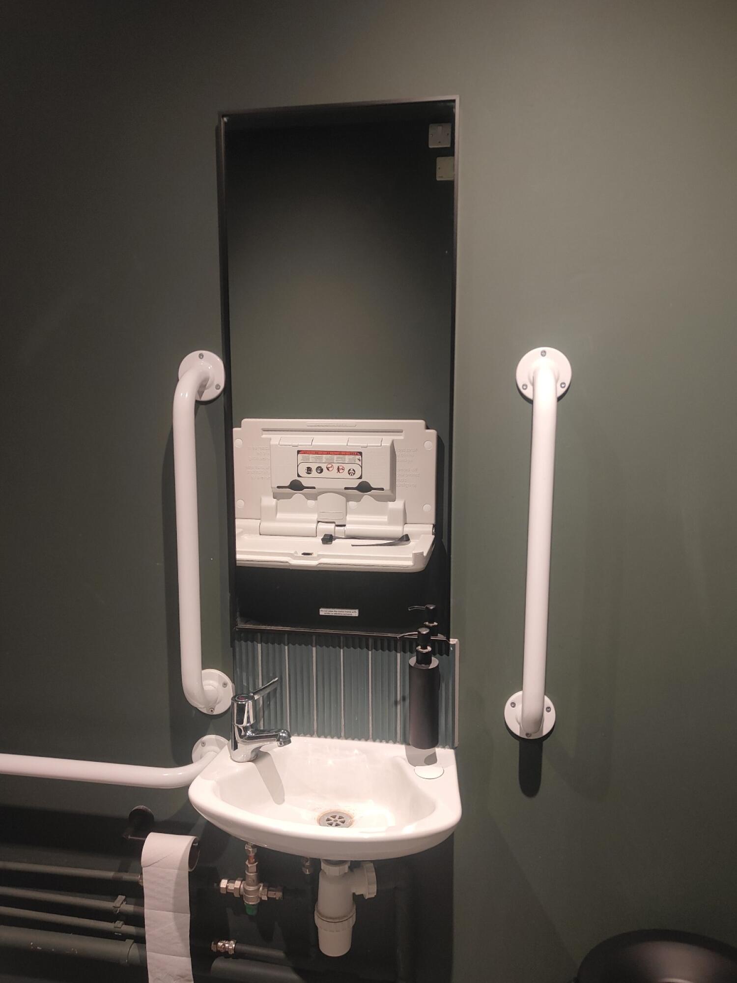 From entrance facing right. Sink and mirror ahead.