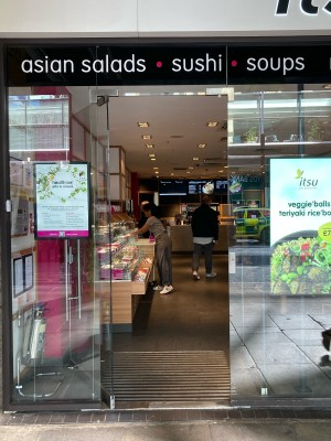 Access via glass door. Push open via vertical metal handrail on right.