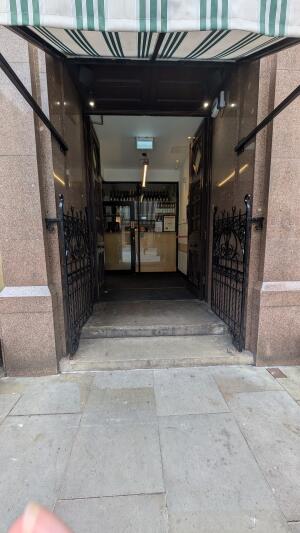 Wooden doors. Push handle in center to open