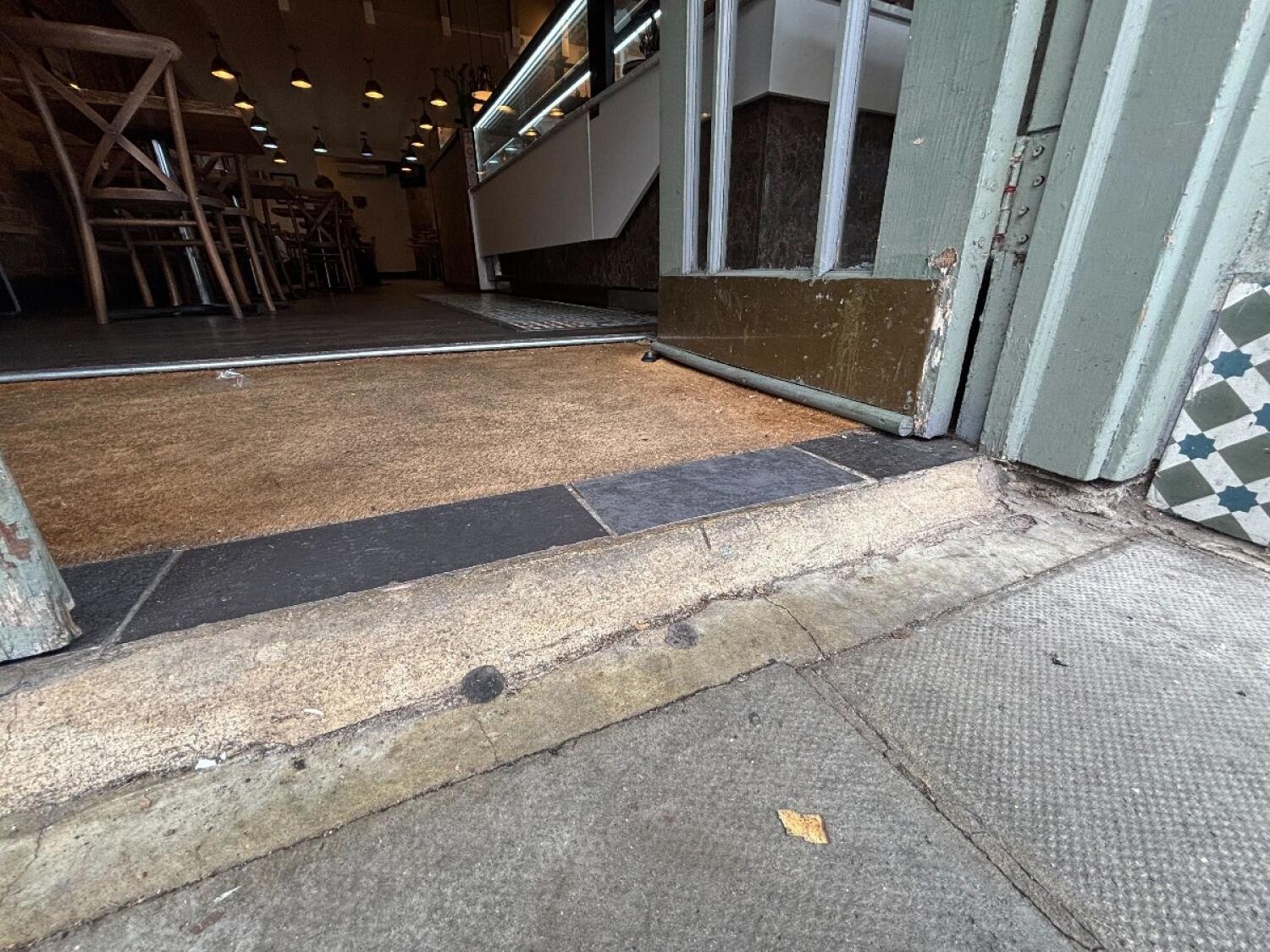 Small step at entrance. Doormat after.
