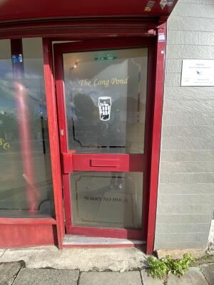 Red framed glass door. Push the door from left to open.