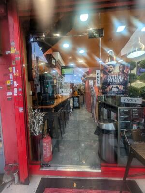 Full glass doors in front. Silver handle on right. Pull to open.