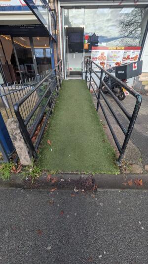 From street facing venue. Ramp up to door. Handrails on both sides
