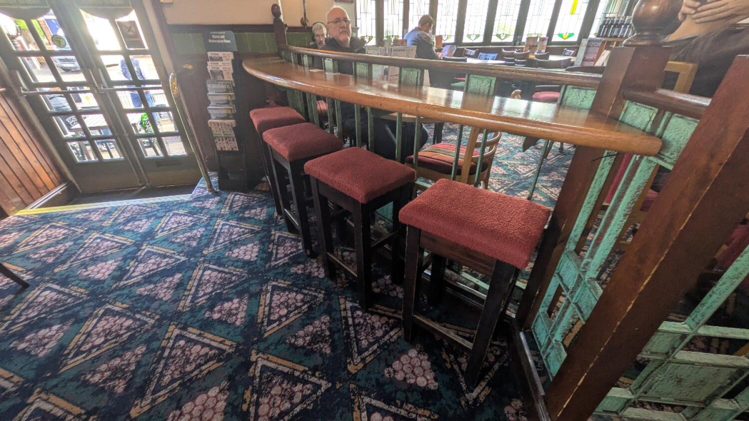 From ramp facing right. High table and stools ahead