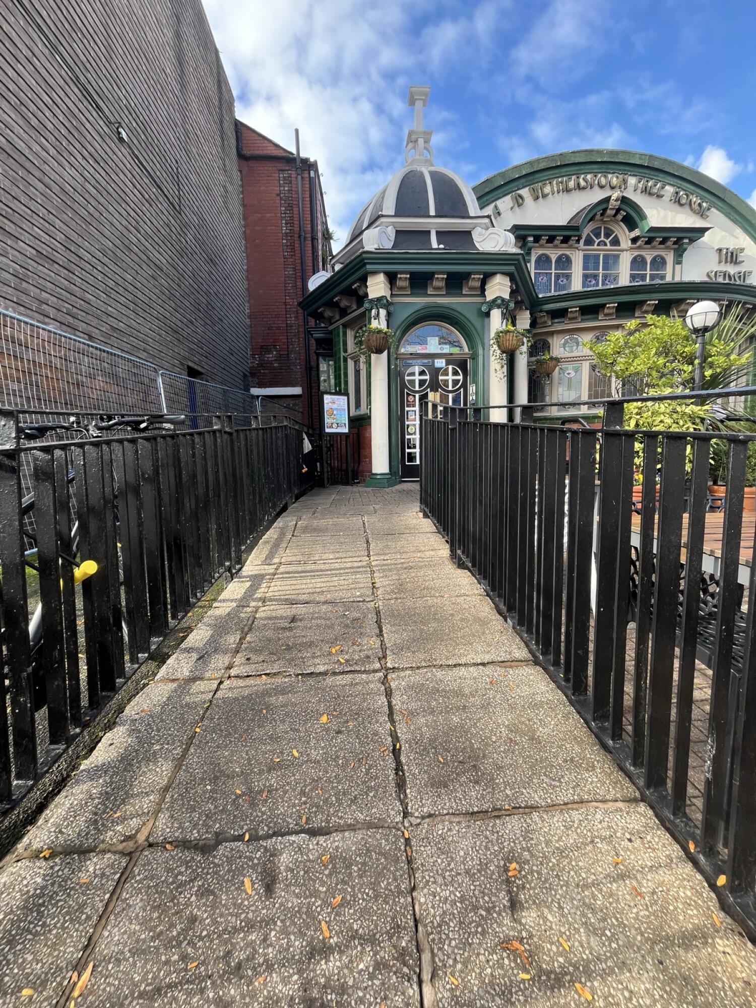 From right opening facing straight. Built in ramp with handrails on both left and right sides.