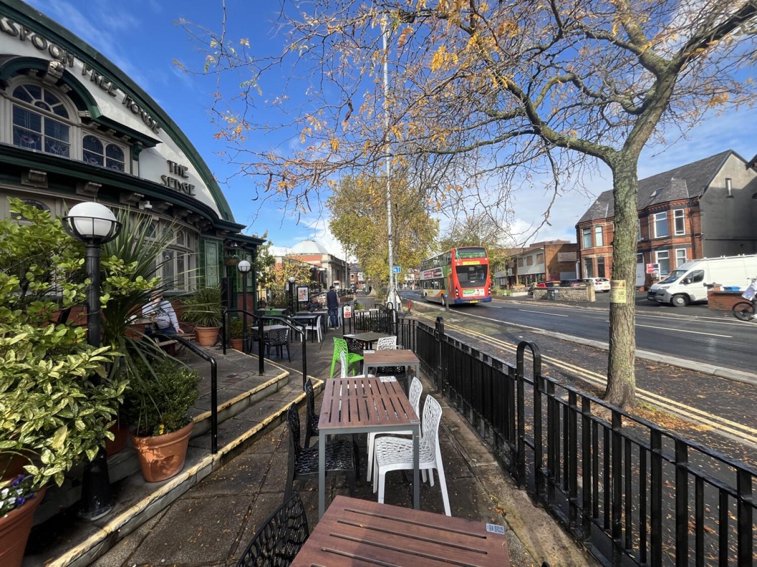 From right street opening facing right. Tables and chairs ahead and back.