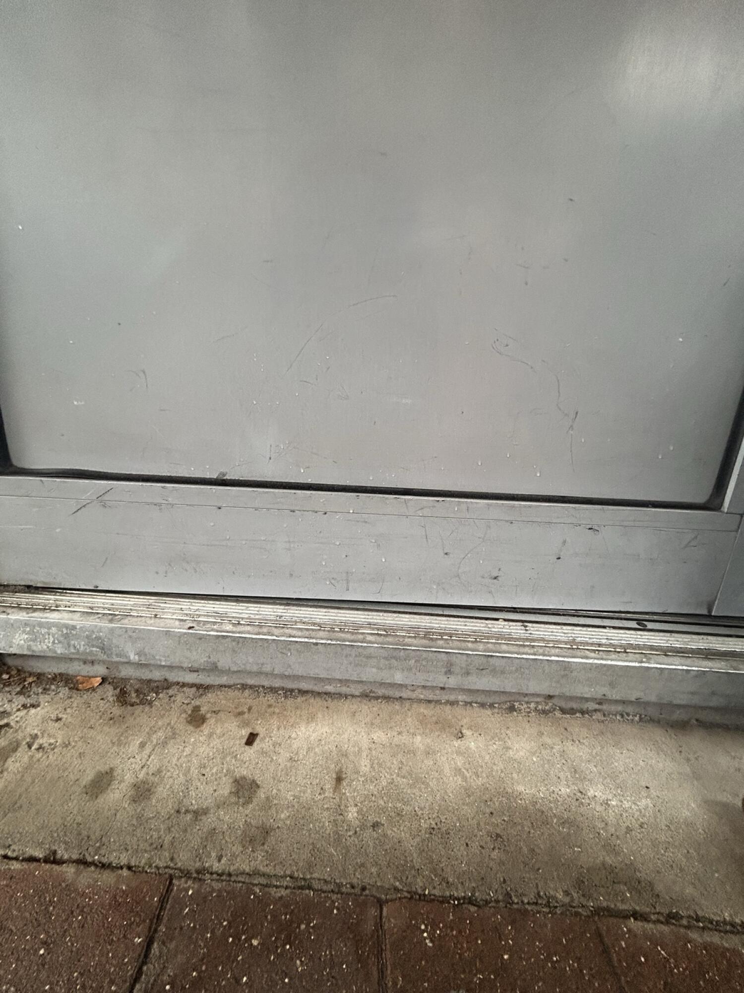 A step up at foot of door.
