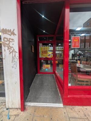 Red frame archway in front. Red frame glass doors at back. Red handle at back right. Pull to open.
