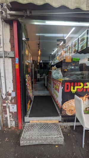 Glass door. Push handle on right to open